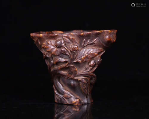 AN AGARWOOD CARVED FLORAL CUP