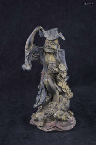 A BRONZE MOLDED CHARACTER STATUE