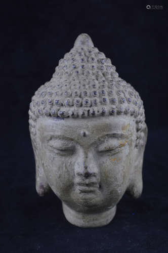 A BRONZE MOLDED BUDDHA HEAD STAUTE