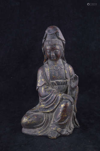 A BRONZE MOLDED GUANYIN STATUE