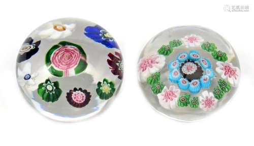 Two miniature Clichy paperweights c.1850, one set with a large Clichy rose within a ring of eight