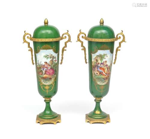 A tall pair of ormolu-mounted Sèvres-style covered vases 19th century, the slender forms painted