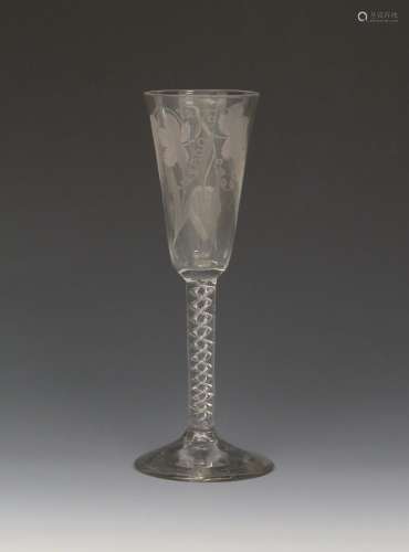 An ale glass c.1760, the slender round funnel bowl engraved with hops and barley, over a mercury