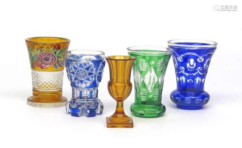 Five Bohemian glass small vases or goblets 19th century, two of flared form flashed in blue, one