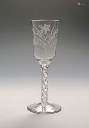 An ale glass with rare engraving c.1760, the slender ogee bowl engraved with two ears of barley