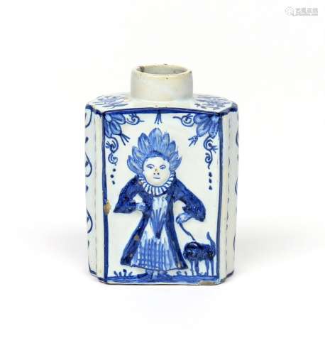 A Delft tea canister late 18th/19th century, the flattened hexagonal form moulded with comical