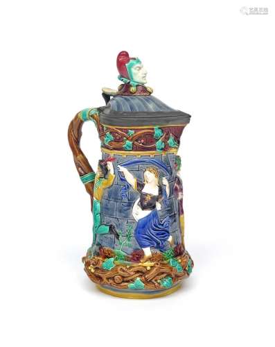 A Minton Majolica ewer or 'Tower' jug date code for 1870, moulded in high relief with four figures