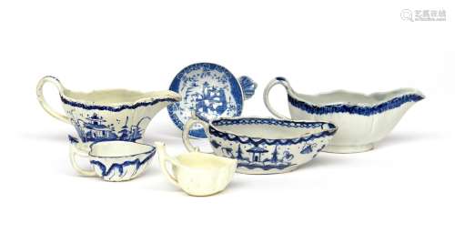 Three pearlware blue and white small sauceboats late 18th/early 19th century, two painted with