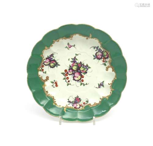 A Worcester junket dish c.1775, painted to the well with arrangements of spotted fruit within a