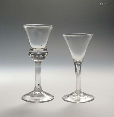 Two large wine glasses c.1760-70, one with a thistle bowl enclosing a row of beaded tears to the