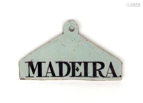 A delftware bin label c.1770-80, of coathanger form, inscribed 'Madeira' in manganese, 13.4cm.