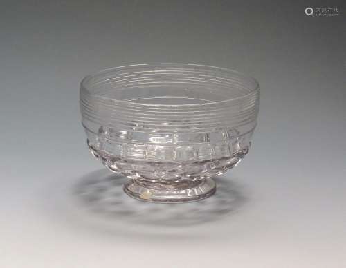 An early glass bowl c.1720, the outer rim with trailed rings above a diamond moulded base over a low