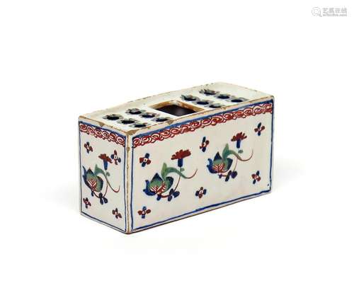 A small delftware polychrome flower brick c.1730-50, of rectangular form, painted in red, green