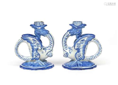 A pair of Delft chambersticks 19th century, formed as winged mythical beasts with open mouths
