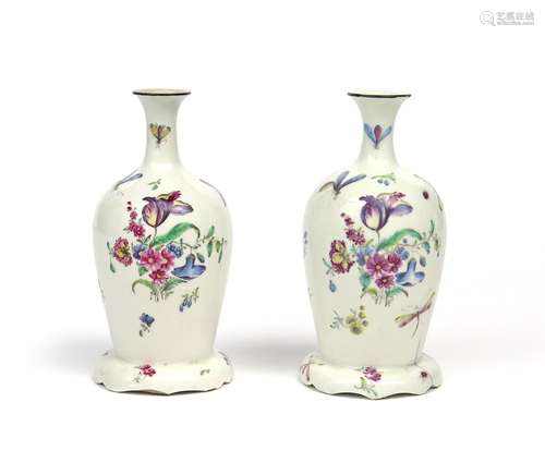 A rare pair of Bow vases c.1760, of ovoid shaped, each raised on a shaped domed foot with a short