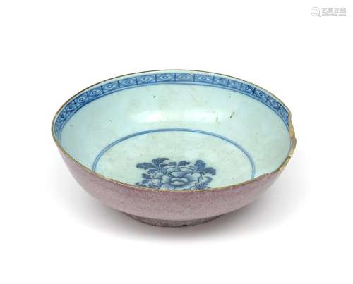 A delftware punch bowl c.1770, painted in blue to the interior with a large peony spray, the rim