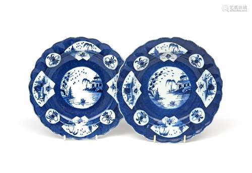 A small pair of Bow blue and white plates c.1760, with scalloped rims, painted with circular and