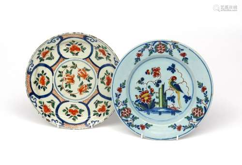 Two London delftware plates c.1720-40, one painted in red, green and blue with stylized flower