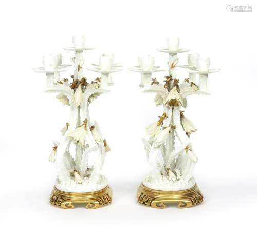 A pair of Moore Bros. porcelain candelabra late 19th century, modelled as five branches of flowering