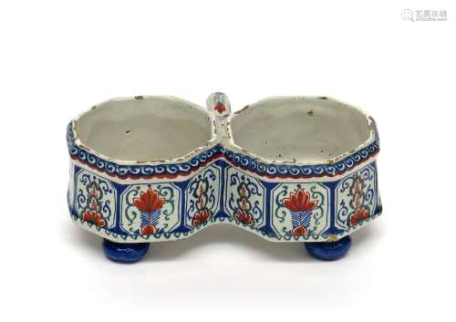 A Delft confiture or bottle holder c.1720, formed of two octagonal wells, linked with a simple