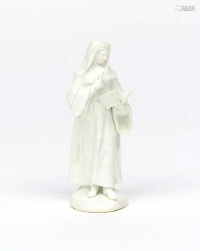 A Bow white-glazed figure of a nun c.1755, standing and reading from a prayer book held in her