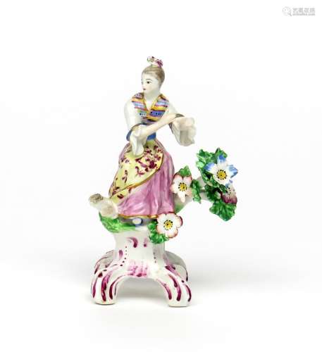 A small Bow figure of a lady dancing c.1765, her hands outstretched and head turned to her right,