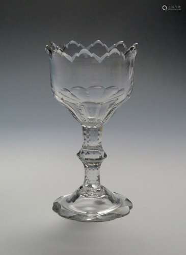 A heavy sweetmeat glass c.1780, the deep bowl finely cut with a dentate rim, the fluted bowl base