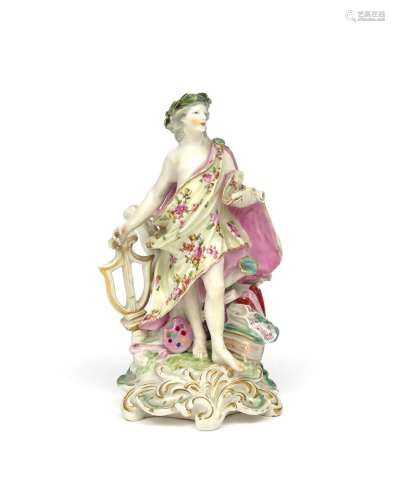 A Derby figure of Apollo c.1760, standing amidst trophies of the Arts including books, a palette and