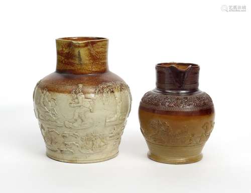 Two large brown stoneware jugs 19th century, the larger unusually sprigged with the comic figure