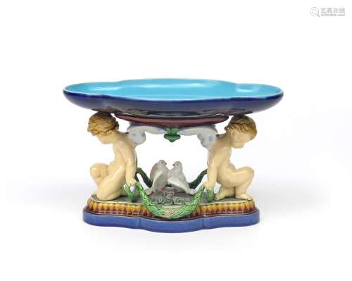 A Minton Majolica centrepiece in the French manner date code for 1868, the quatrefoil dish glazed