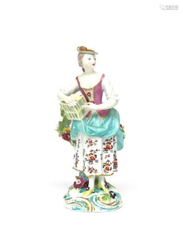 A Derby figure of Matrimony c.1765, personified as a maiden holding a small bird cage which rests on