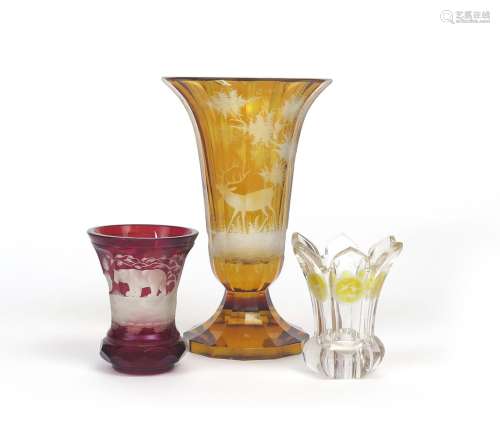 Three Bohemian glass vases 19th century, one flashed in ruby and cut with a bear hunt scene, the