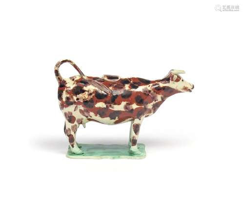 A Staffordshire pearlware cow creamer and cover late 18th/early 19th century, standing four square