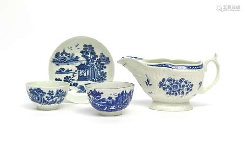 A Worcester blue and white teabowl and saucer c.1775, printed with the Man in the Pavilion