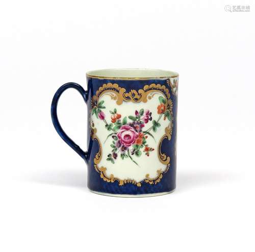 A small Worcester mug c.1770-75, the cylindrical form painted with shaped panels of polychrome