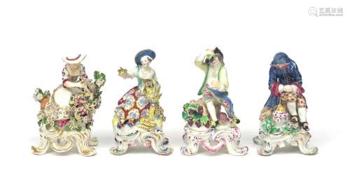 A matched set of Bow figures of the Rustic Seasons c.1765, each modelled seated on a tall footed