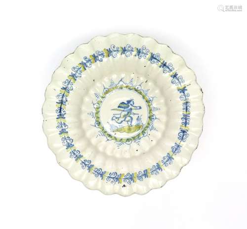A Continental tin-glazed lobed dish late 17th/early 18th century, painted in blue and yellow with