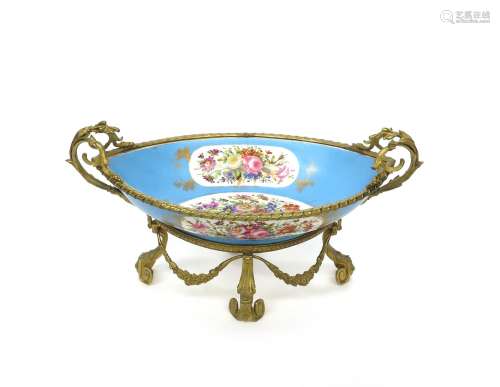 An ormolu-mounted Sèvres-style bowl or centrepiece 19th century, of navette shape, painted with