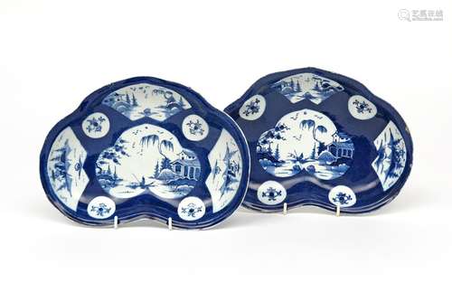 Two Bow blue and white kidney-shaped dishes c.1760, painted with a shaped panel of a figure in a