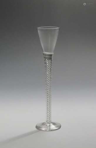 A tall cordial glass c.1770, with drawn trumpet bowl rising from a slender airtwist stem, 22cm.