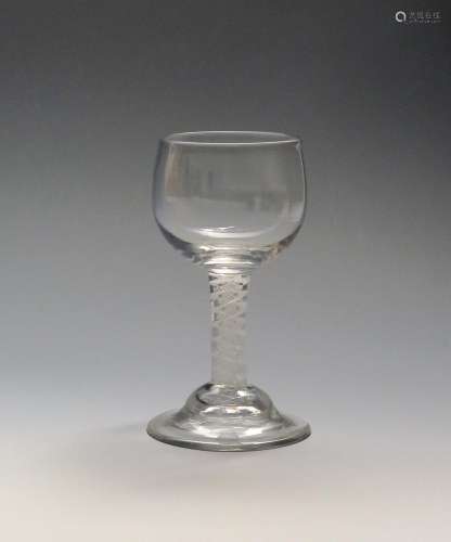 A mead or honey glass c.1770, with generous cup shaped bowl raised on a short double series opaque