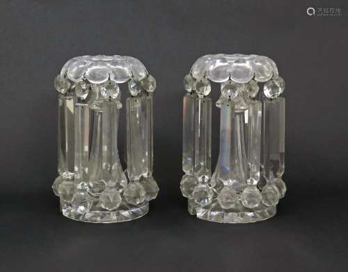 A pair of glass table lustres 19th century, each hung with eleven heavy lustres in two parts from
