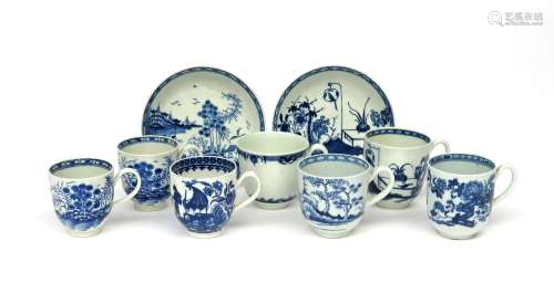 Seven Worcester and Caughley blue and white coffee cups c.1765-80, two painted with the Rock