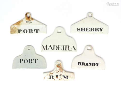 Six creamware bin labels 19th century, including Minton, of varying coathanger form, titled in black