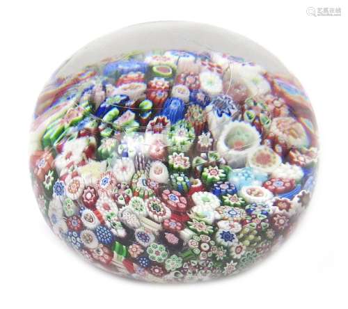 A small Baccarat millefiori paperweight c.1850, set with a multitude of colourful canes, 6cm dia.