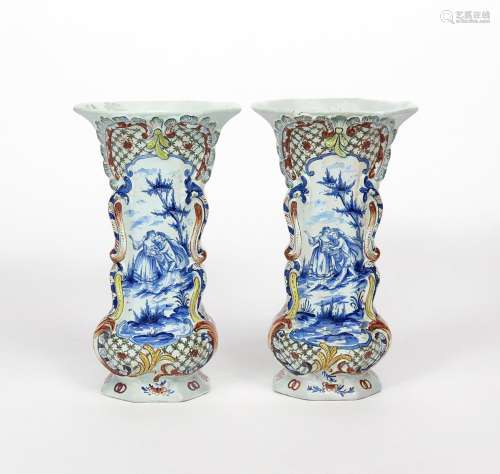 A pair of Delft vases 19th century, of flattened octagonal form, each painted in blue with a