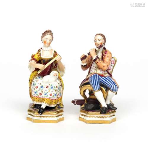 A pair of Derby figures of musicians c.1800, seated on high-backed chairs, he playing the flute