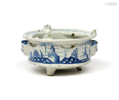 A Delftware food warmer dated 1787, possibly English, the sides painted in blue with low huts beside
