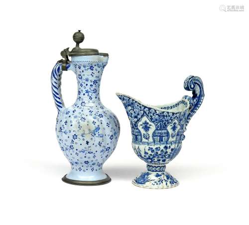 A Rouen faïence ewer 18th century, of fluted helmet shape, painted in blue with shaped panels and