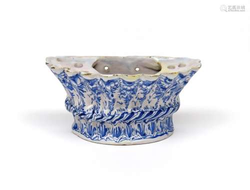 A Delftware bough pot c.1750, possibly English, of fluted D shape, painted in blue with a formal